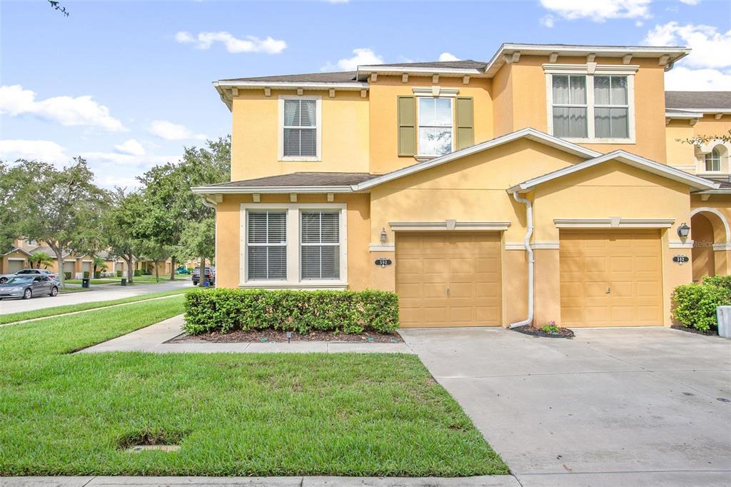 front view of a house with a yard