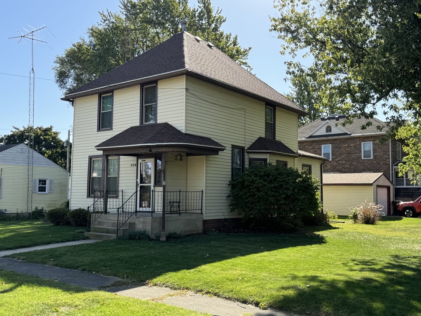 a front view of a house with a garden