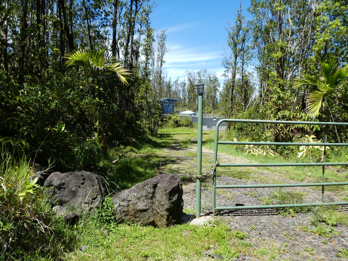 Front entrance with gate and gravel driveway to the house giving you privacy from the road