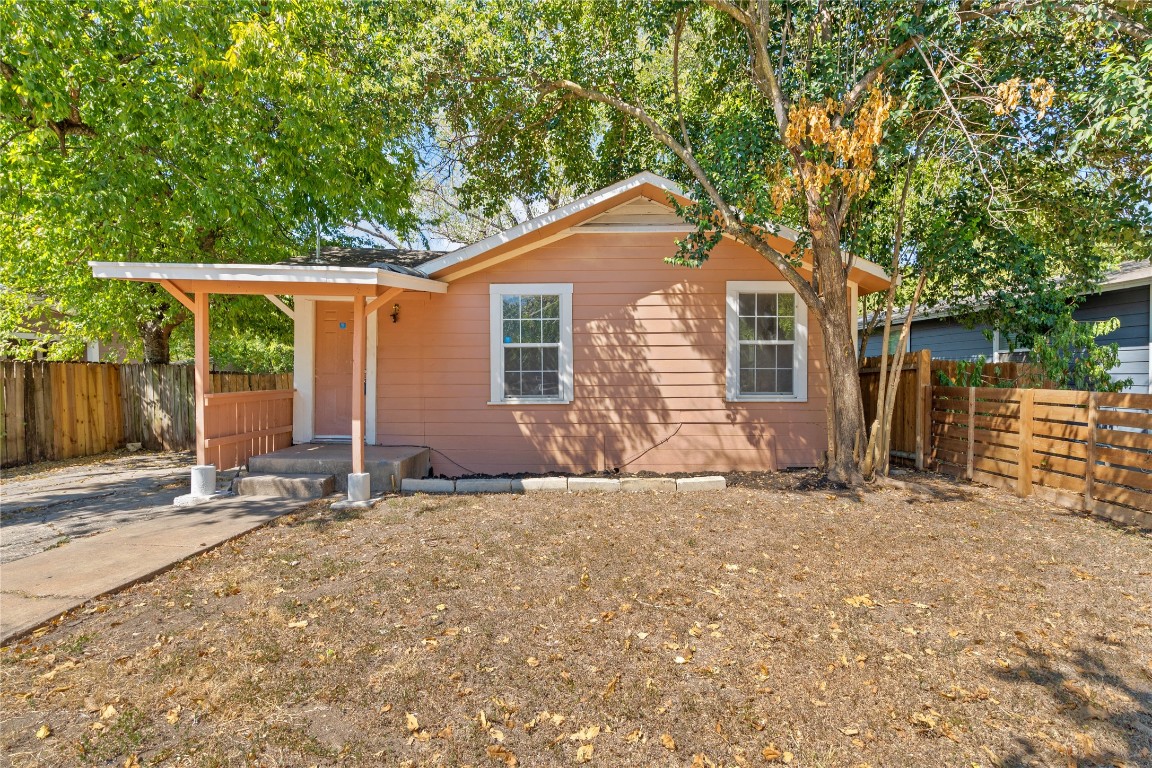 a house with a large tree in front of it