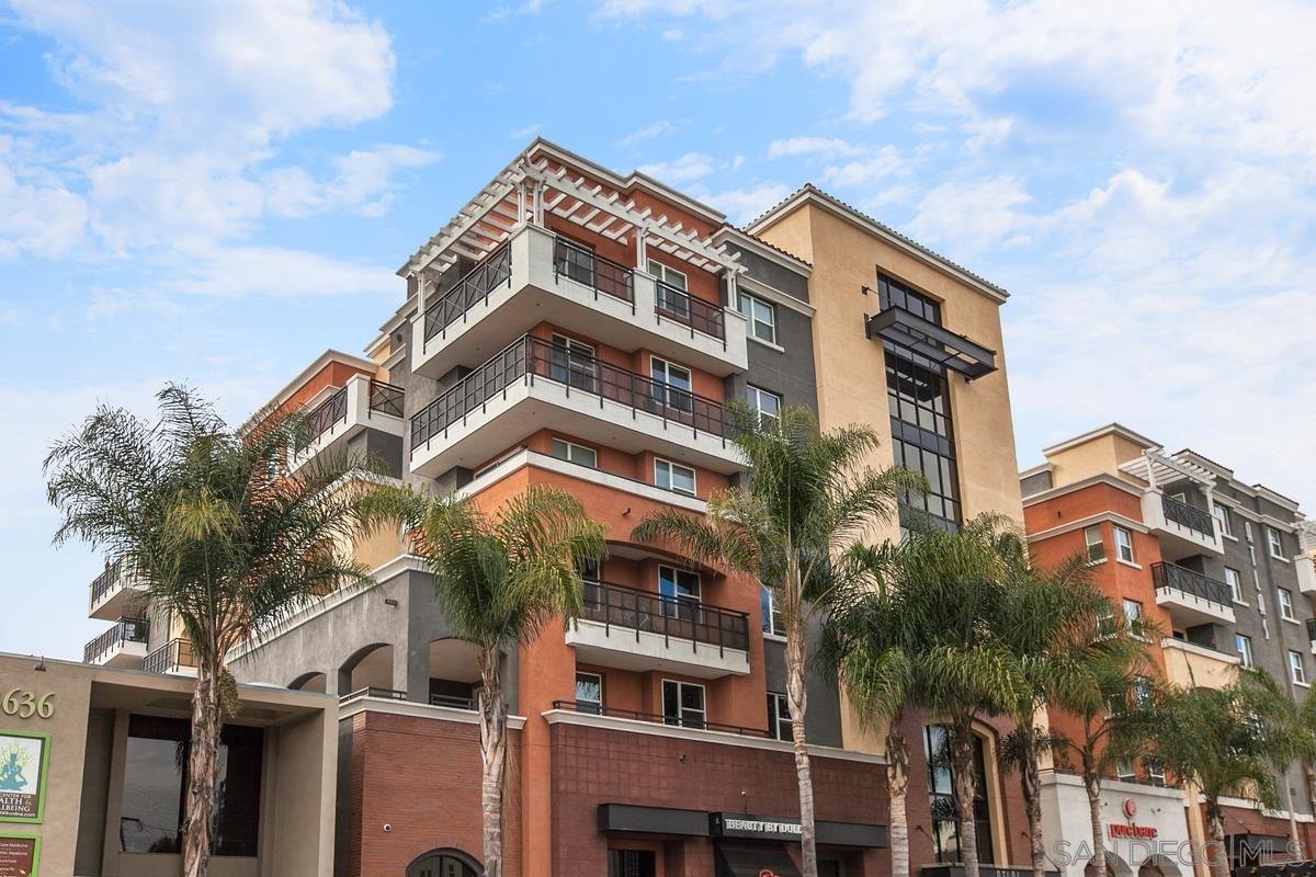 a view of a building with a palm tree