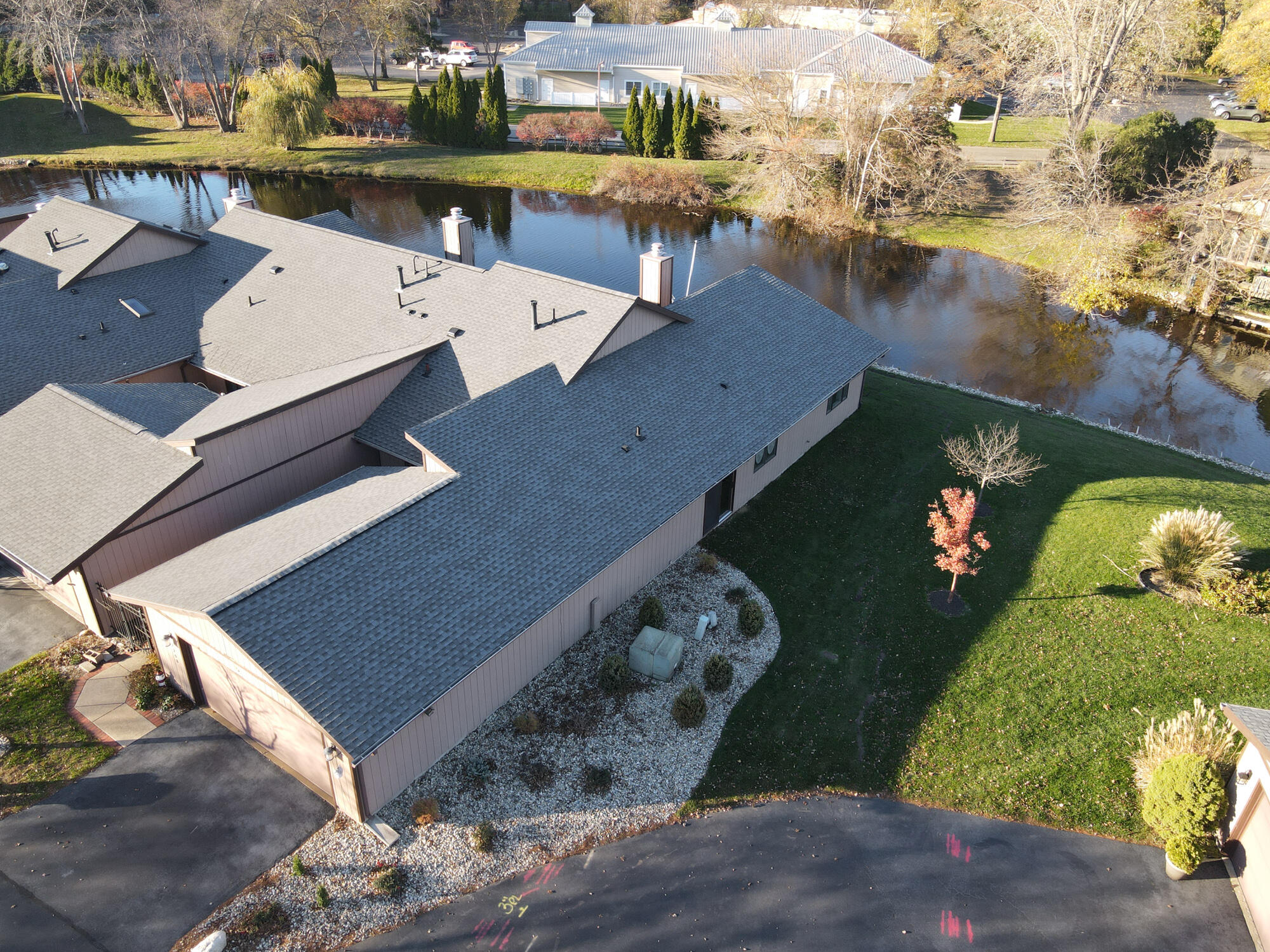 an aerial view of a house with a ocean view