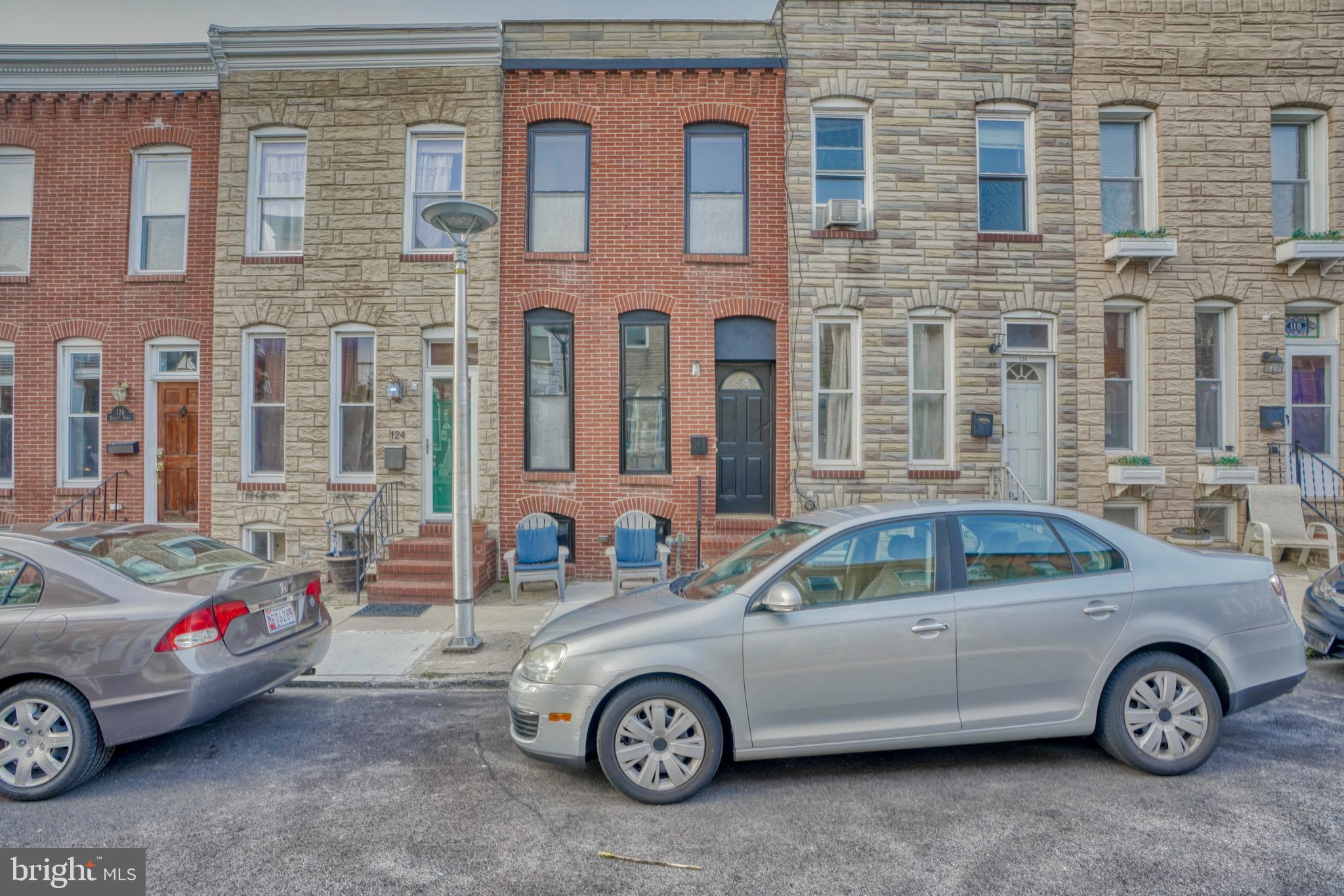 a front view of a house with parking space