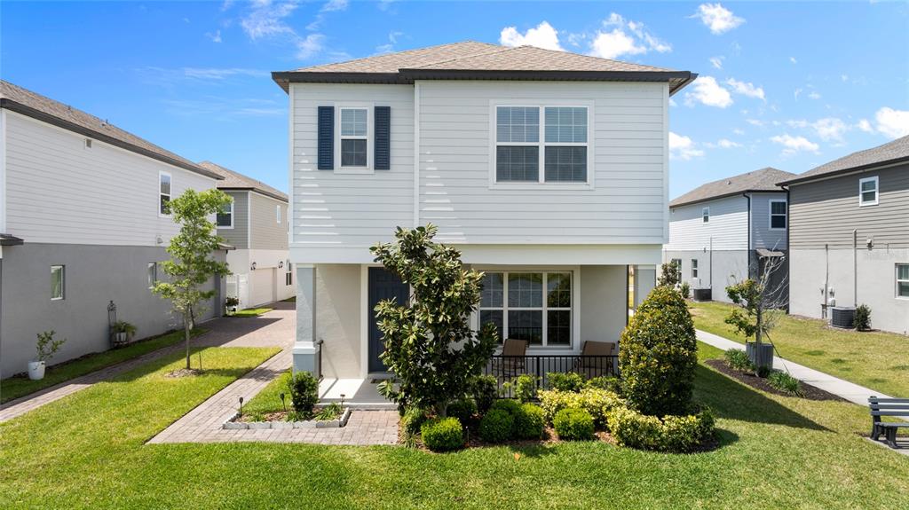 a front view of a house with a yard