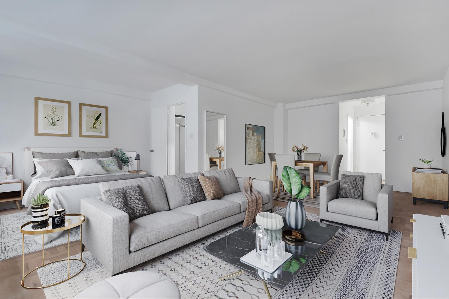 a living room with furniture a rug and a table