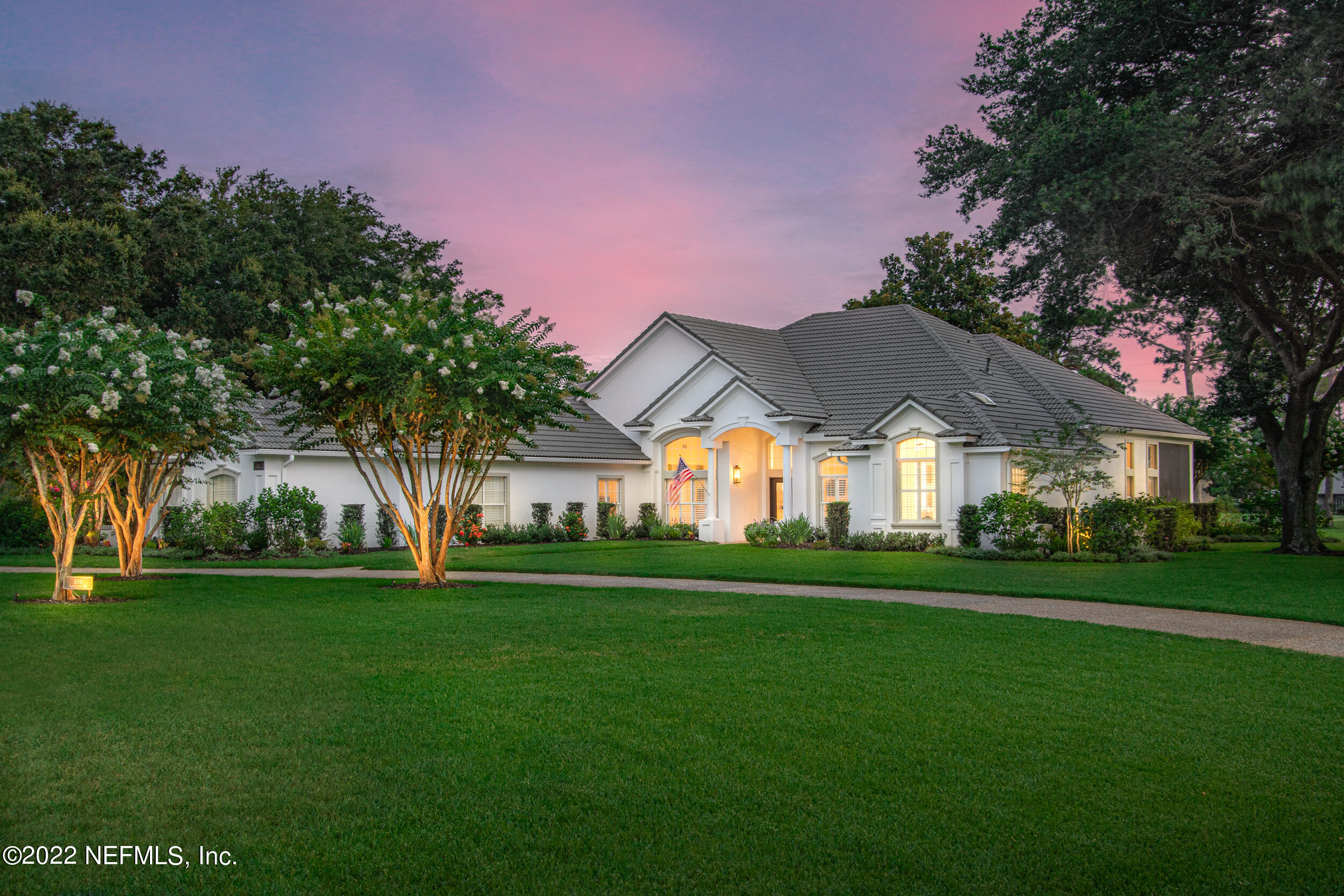 a view of house with outdoor space and garden