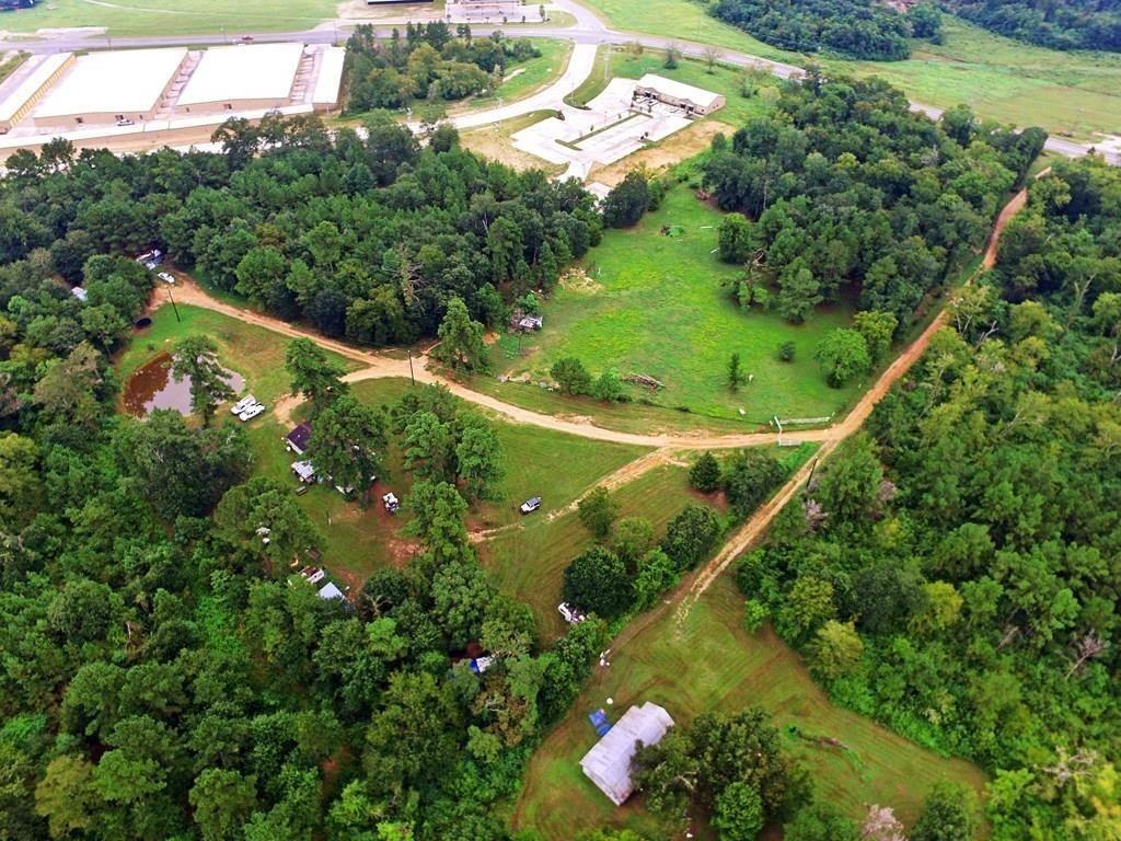 an aerial view of a residential houses with outdoor space and street view