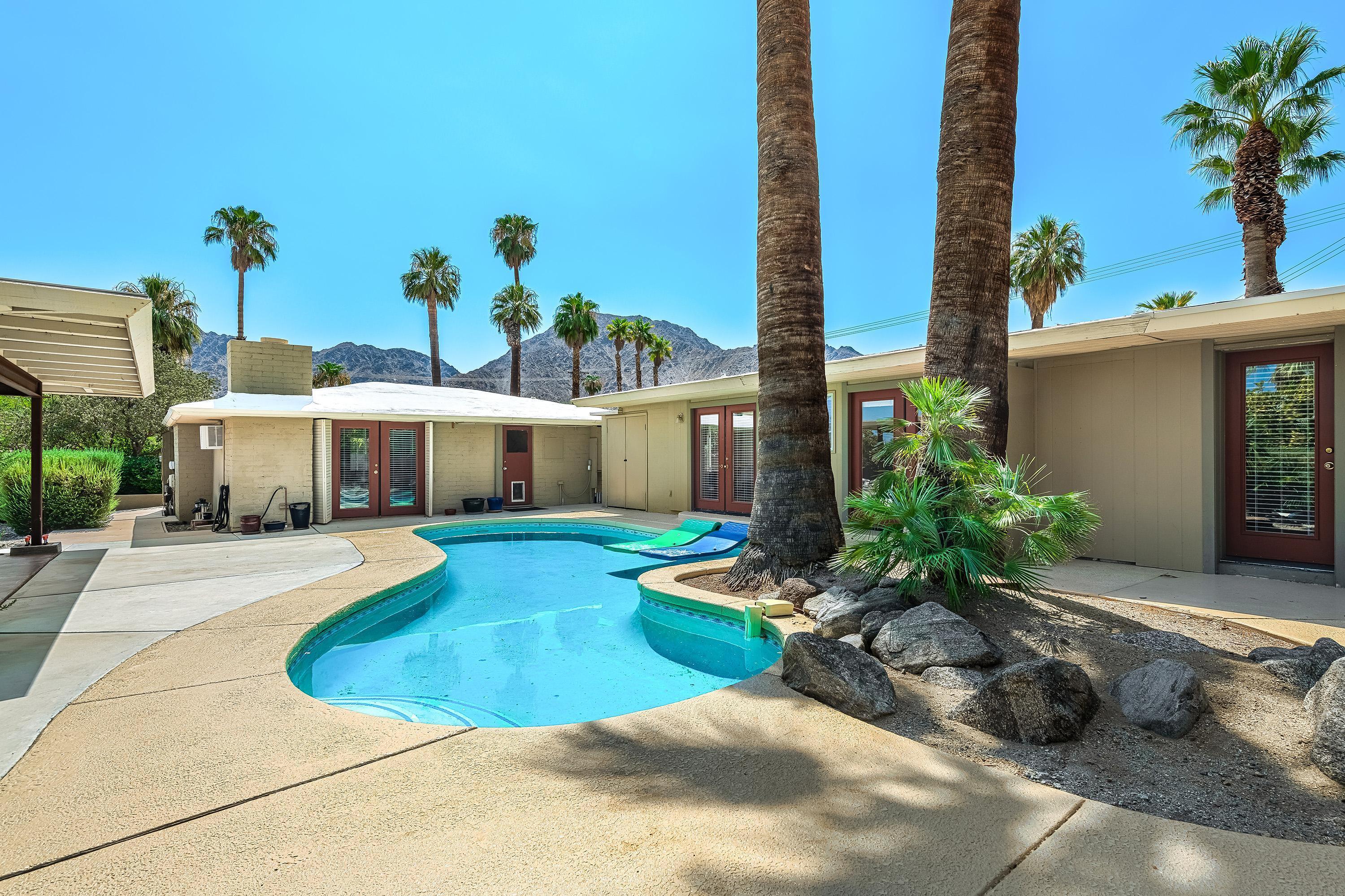 a front view of a house with swimming pool