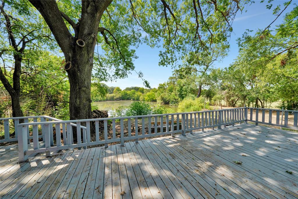 a view of balcony with deck and wooden floor