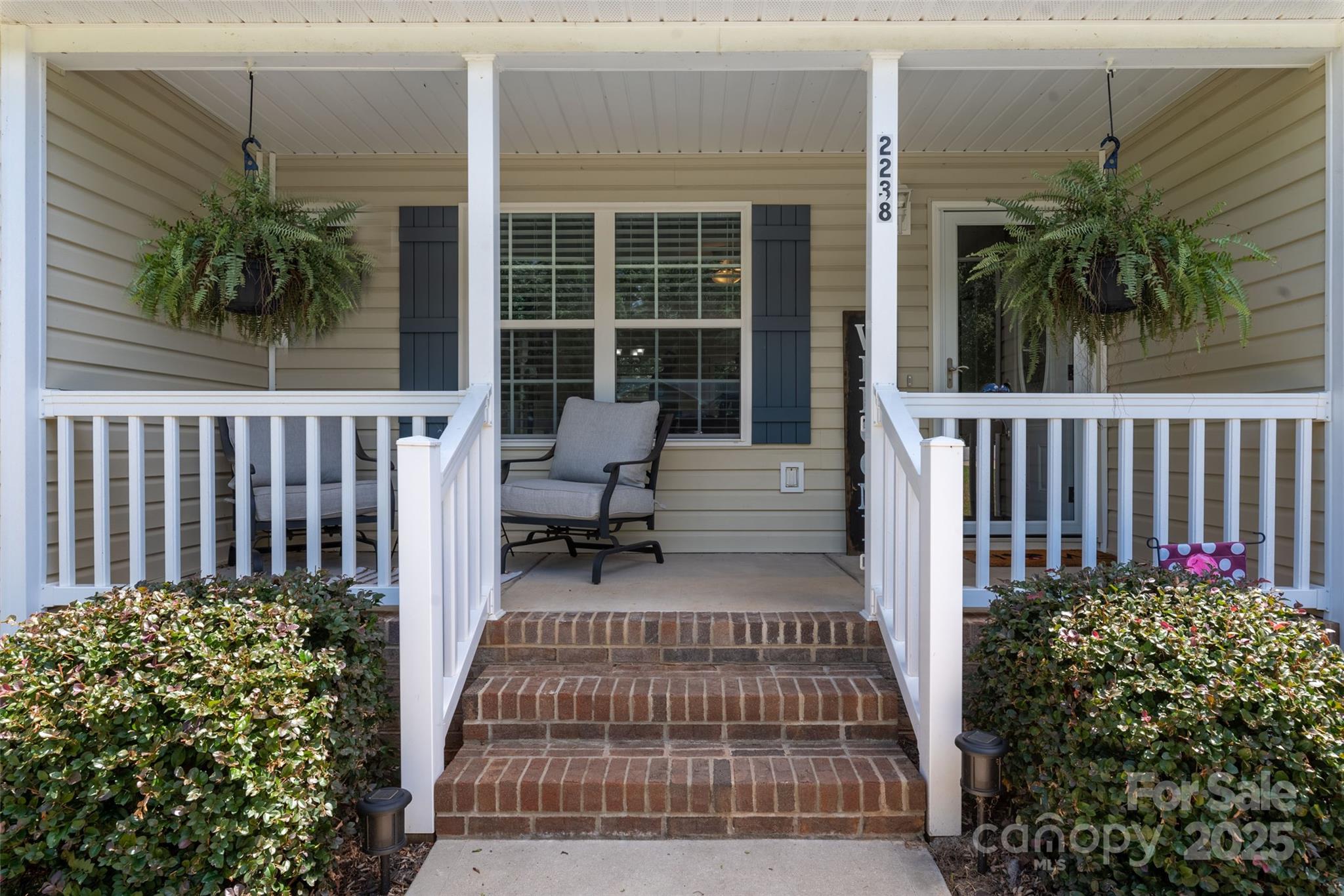 a view of a porch with a bench