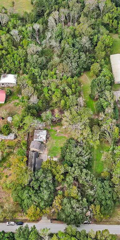 a aerial view of a house with a yard