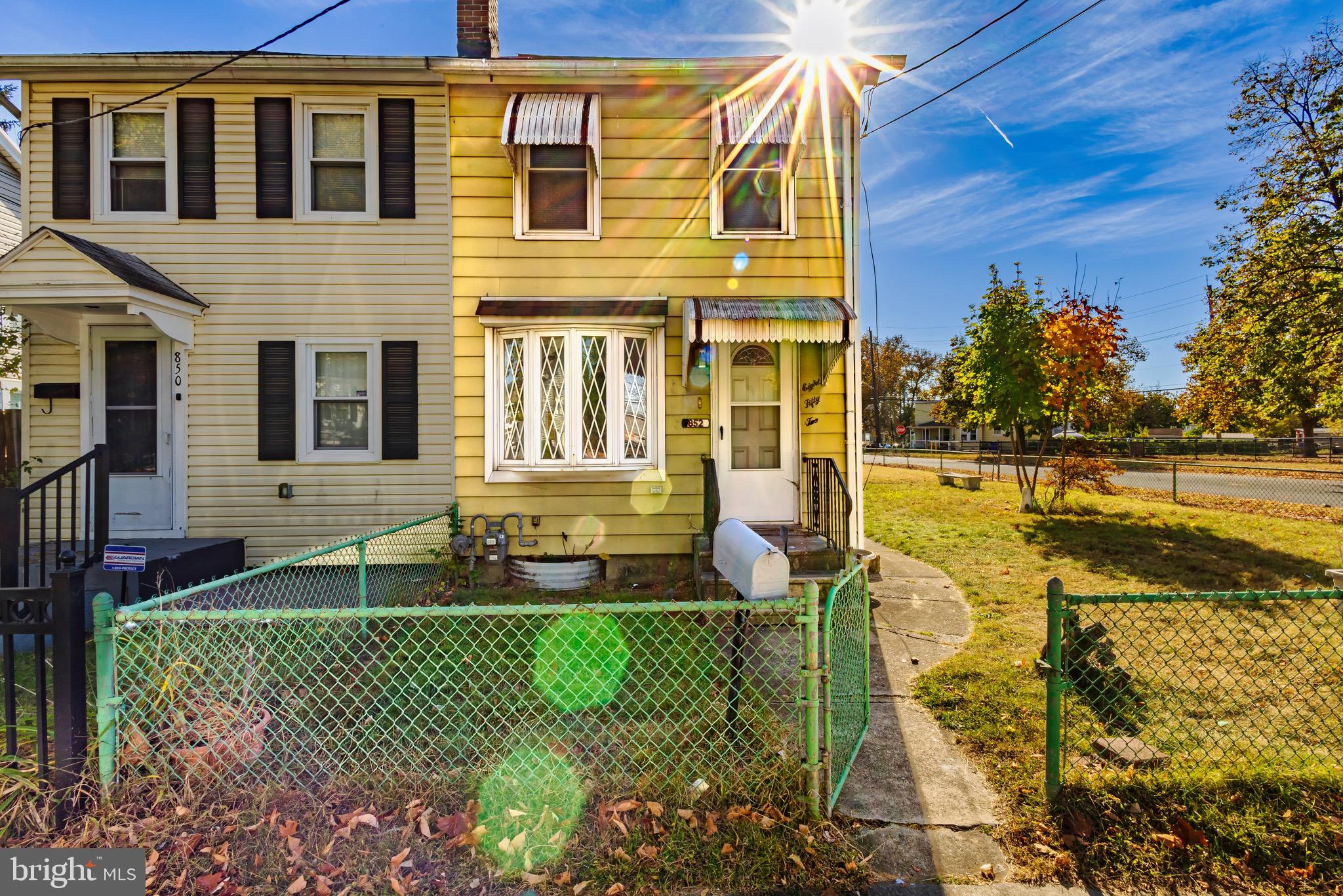 a front view of a house with a yard table and chairs