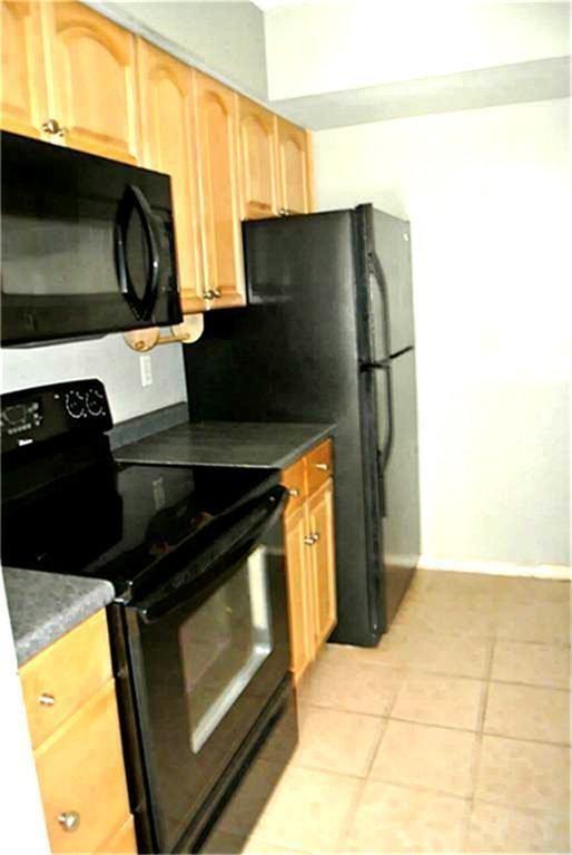 a kitchen with a stove and a microwave