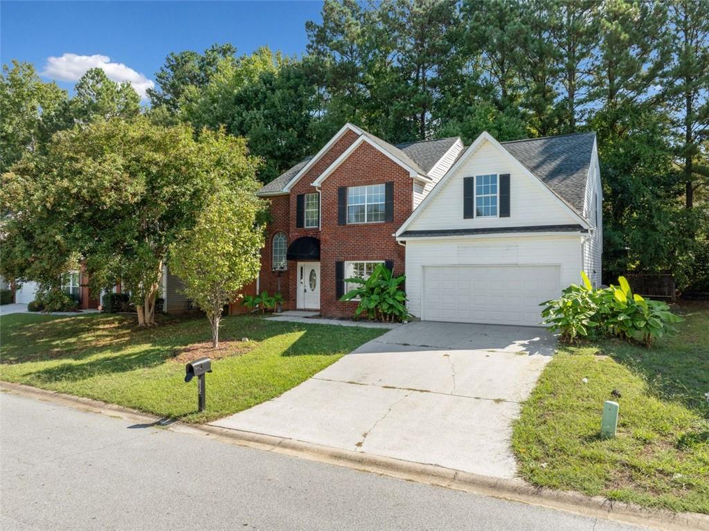 a house with yard in front of it