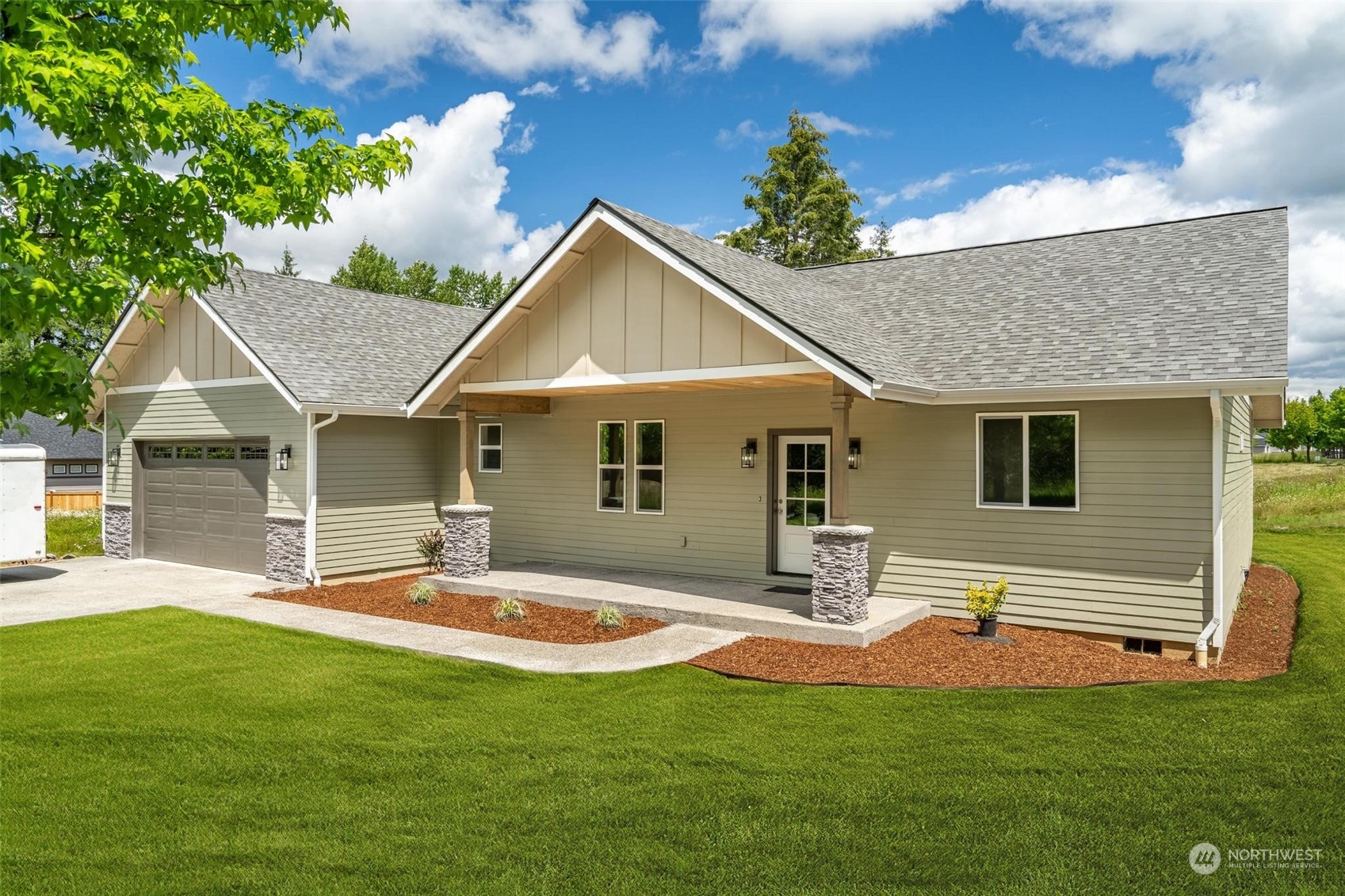 a front view of house with yard and outdoor seating