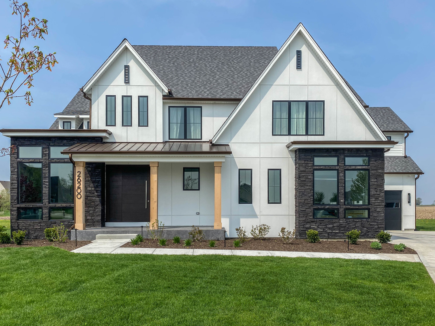 a front view of a house with a yard