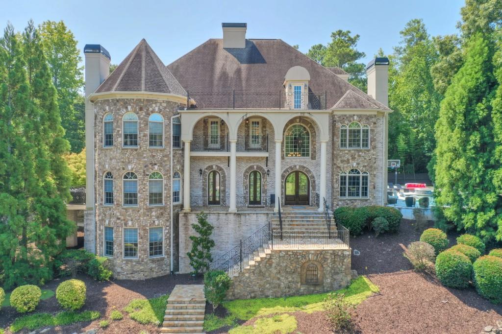 a front view of a house with a garden