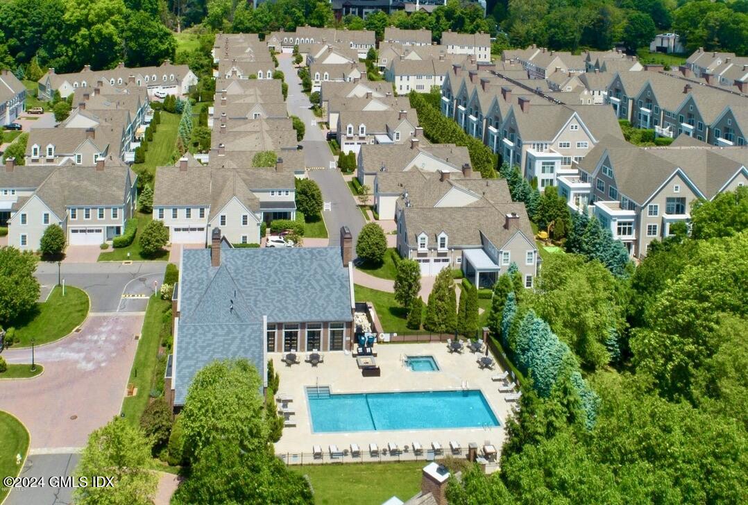 an aerial view of multiple houses with yard