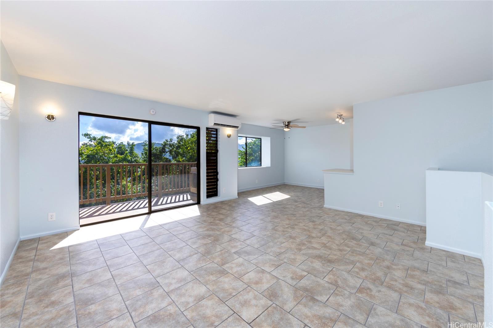 a view of empty room with floor to ceiling window