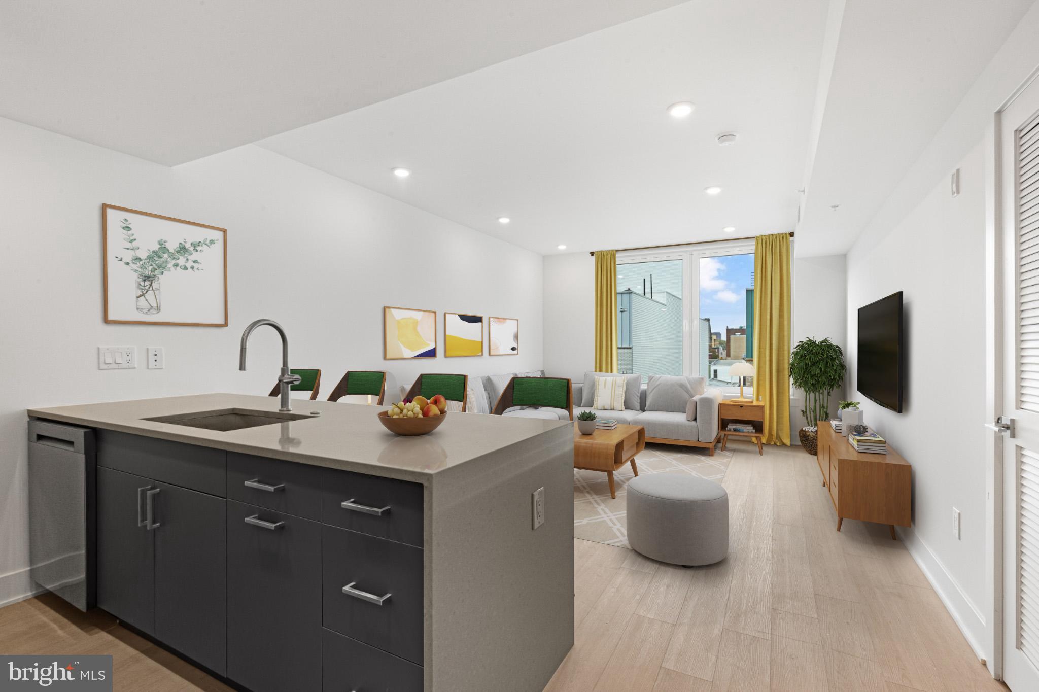 a living room with furniture a flat screen tv and a faucet