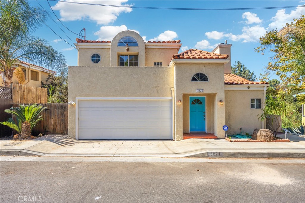 a front view of a house with a garage