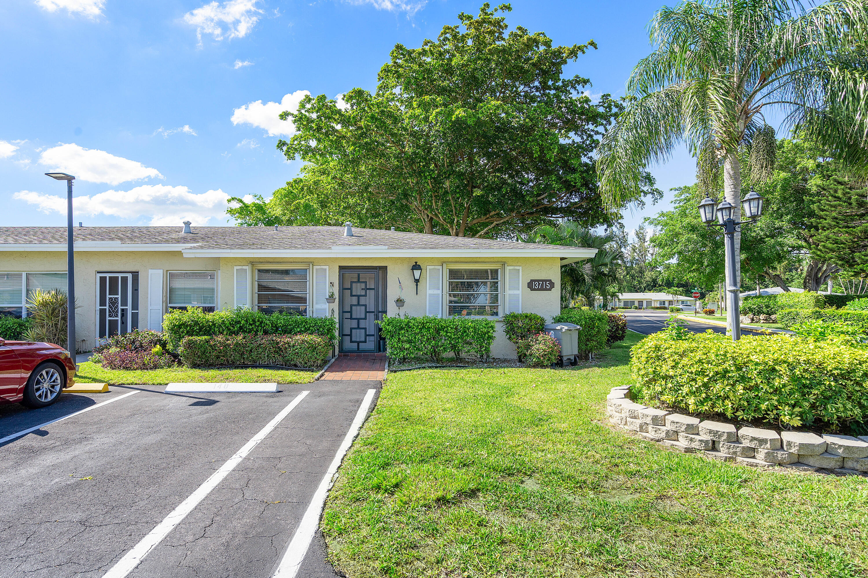 a front view of a house with a yard and porch