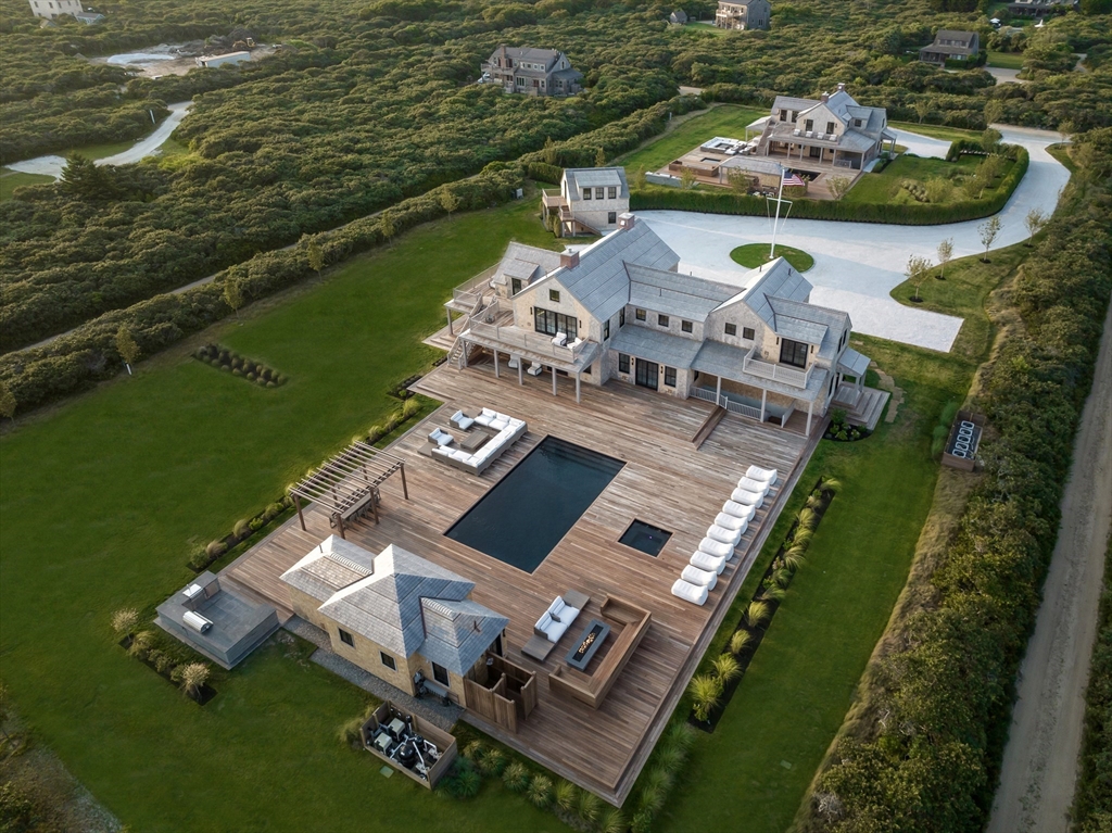 an aerial view of a house with a ocean view