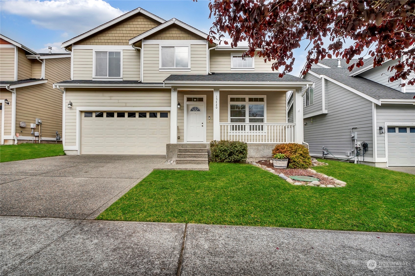 a front view of a house with a yard and porch