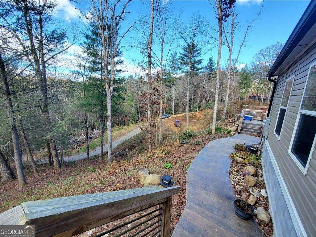 a view of a wooden deck with a backyard