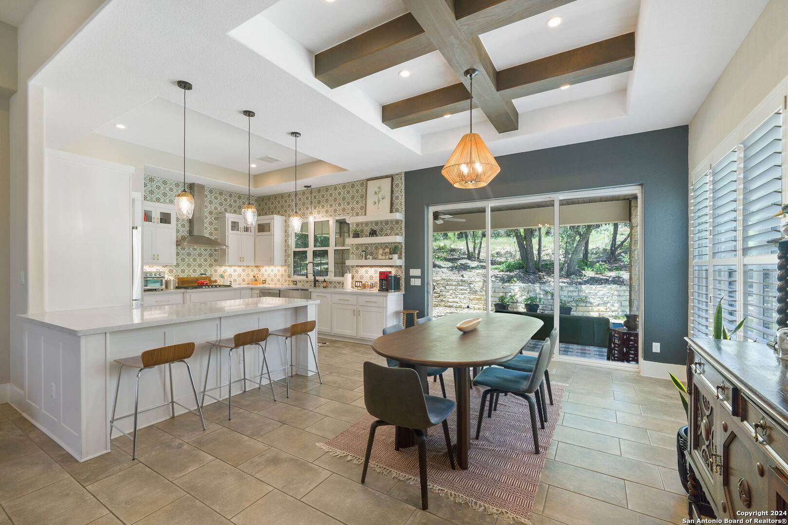 a dining area with a large window and table