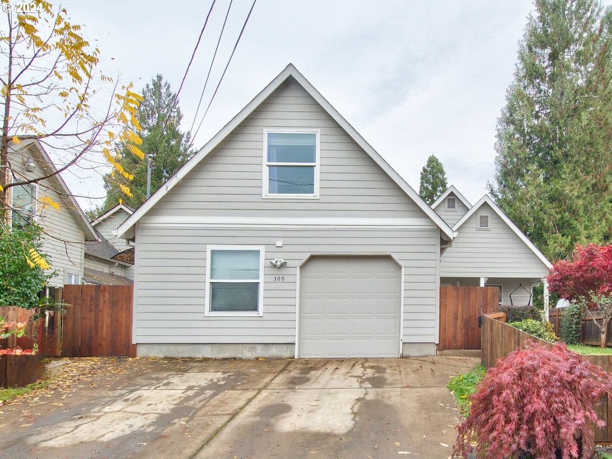 a front view of a house with a garage