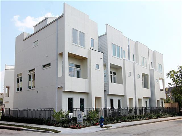 a front view of a building with garden