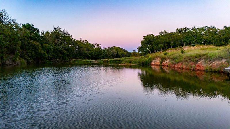 a view of lake with green space