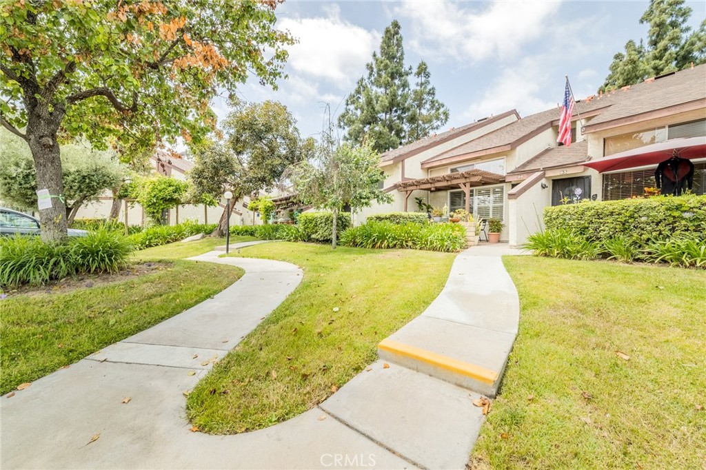 a view of a house with a yard patio and a yard