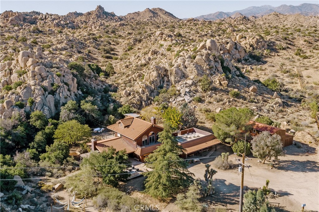 an aerial view of residential house with parking space