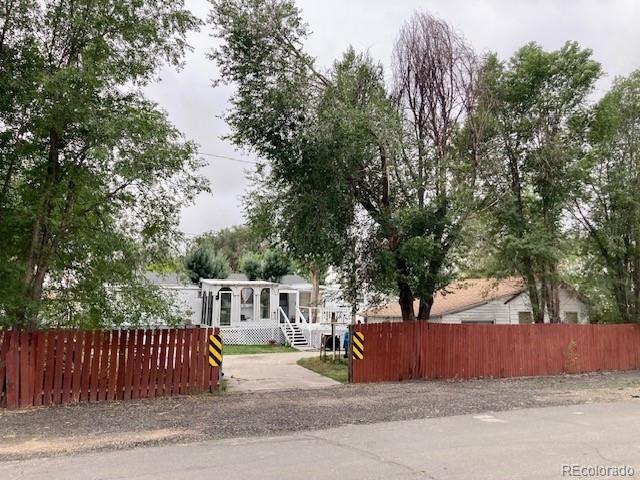 a view of street with a bench next to a road