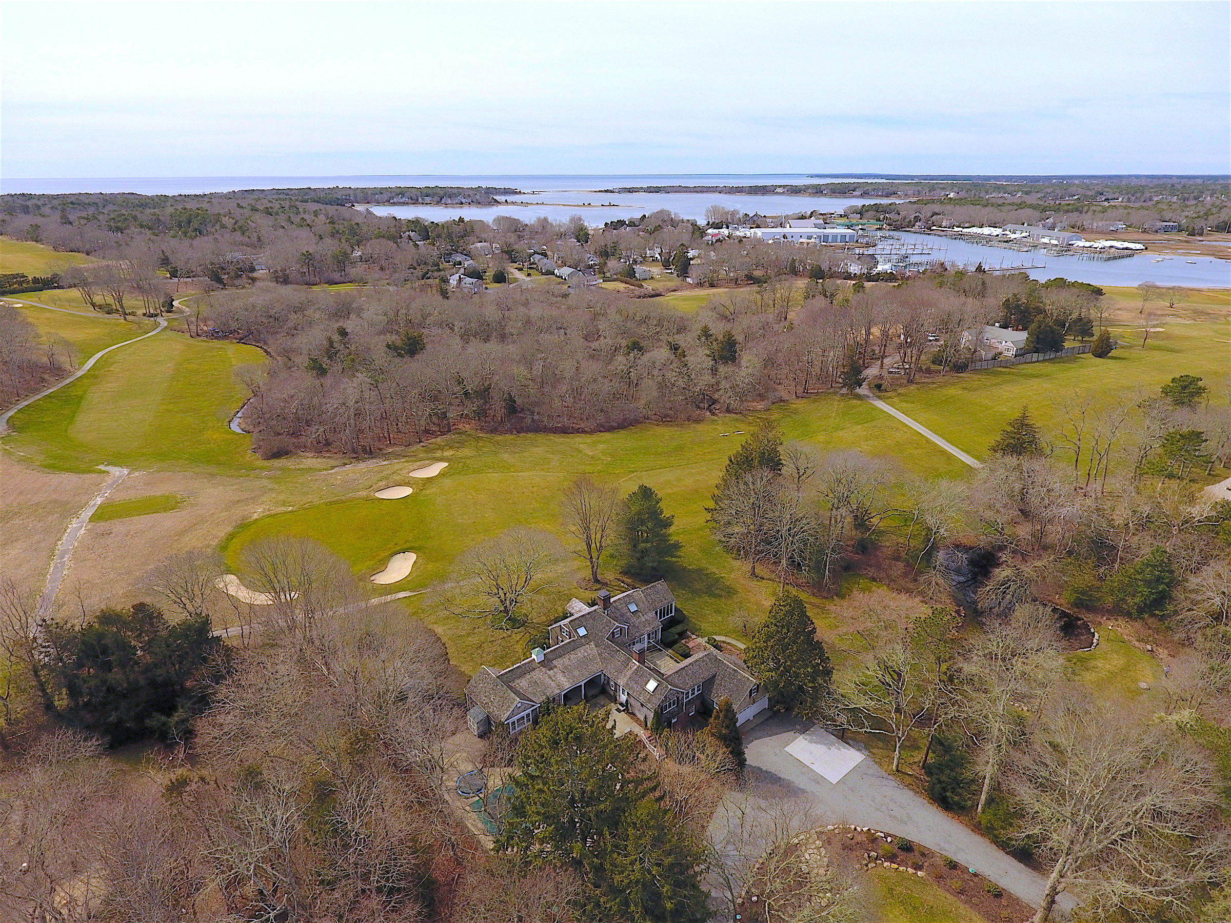 an aerial view of a residential houses with outdoor space