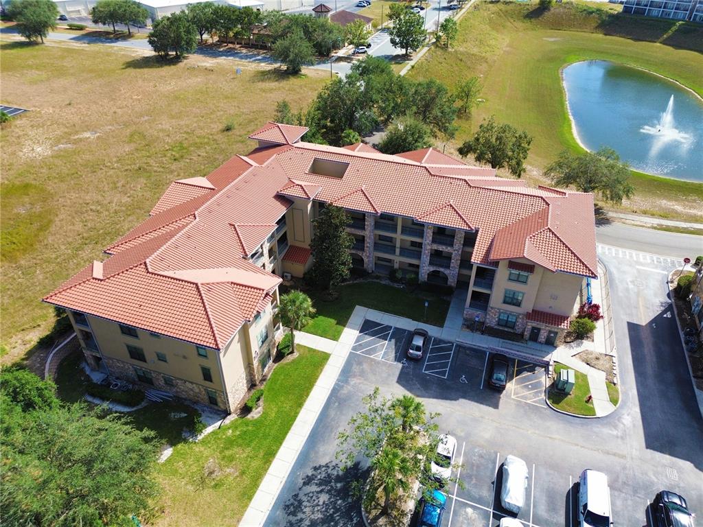 an aerial view of house with yard swimming pool and outdoor seating