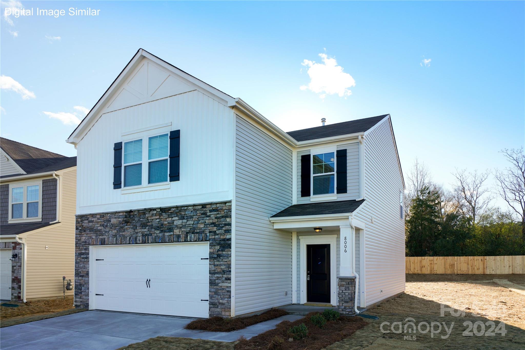 a front view of a house with a garage