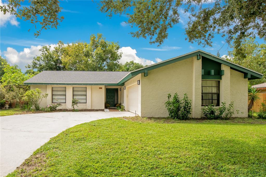 a front view of house with yard and green space