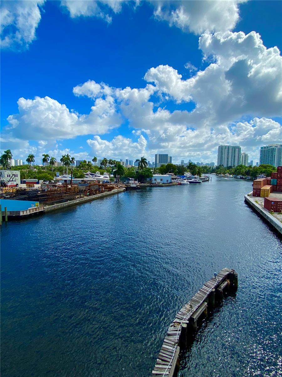 a view of a lake with houses in the back