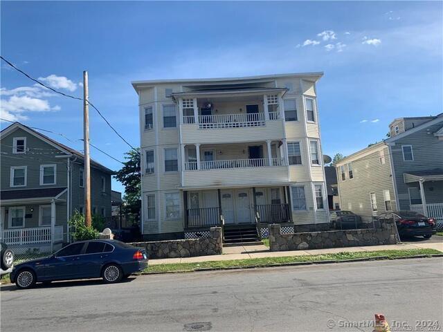 a front view of a building with street view