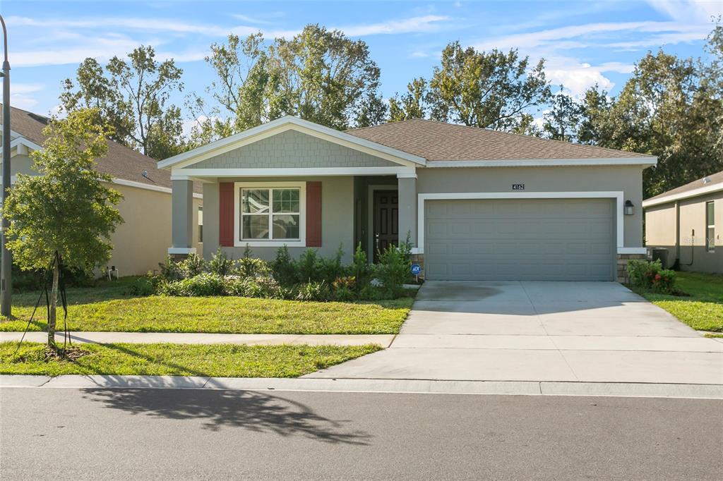 front view of a house with a yard