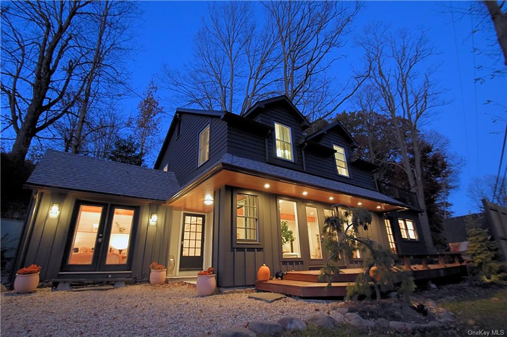 a view of a house with a large tree