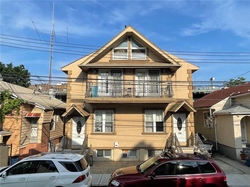 a front view of a house with parking