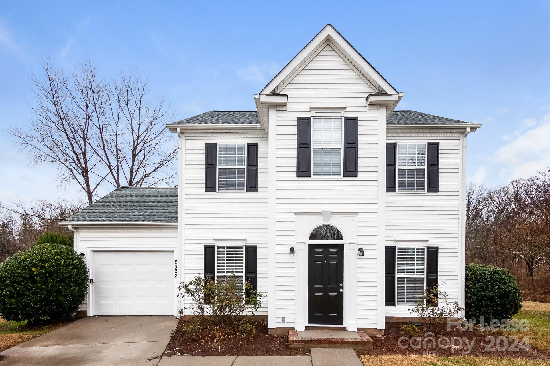 a front view of a house with garage