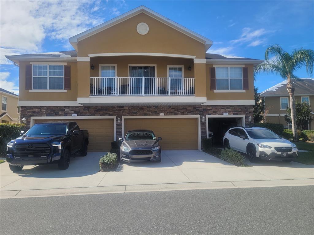 a front view of house with outdoor space and parking