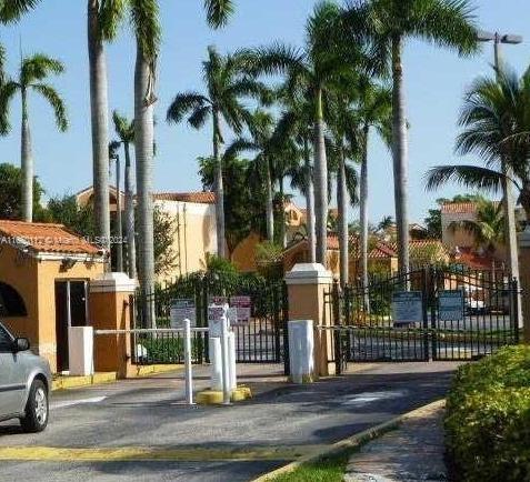 a view of a park with palm trees