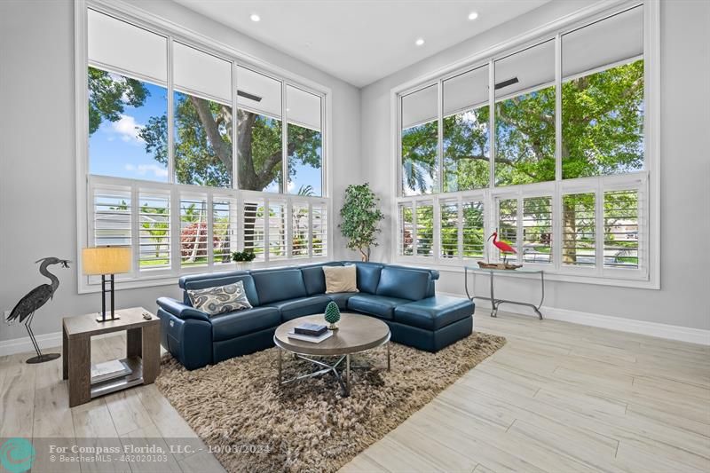 High ceilings and Window wall in formal living room