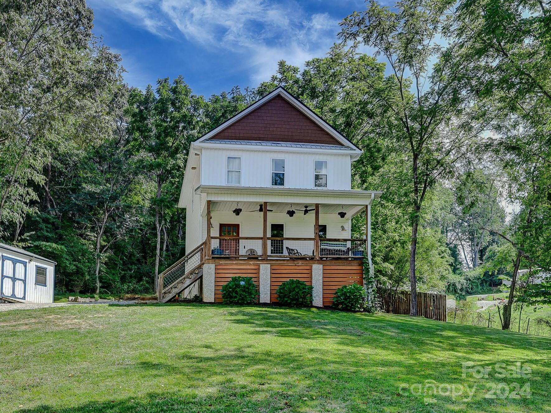 a view of a house with a yard